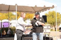 Brent Cain accepts plaque