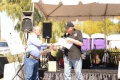 Alberto Gutier accepts plaque