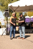 Jim Moore accepts plaque